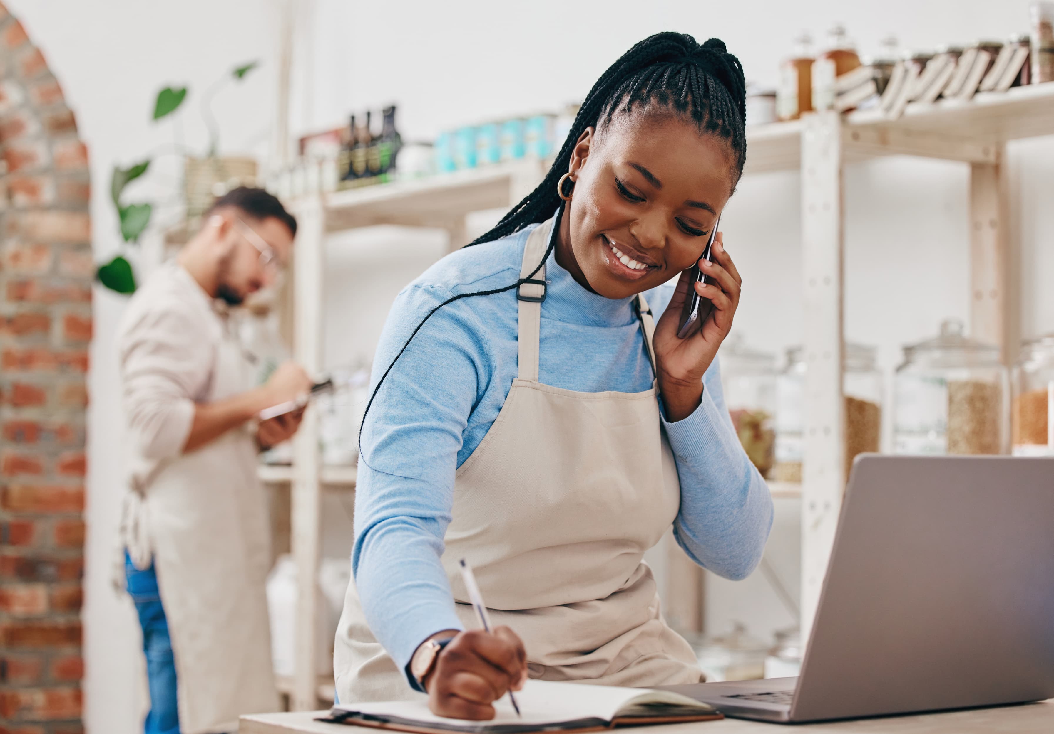A business owner managing her store with confidence